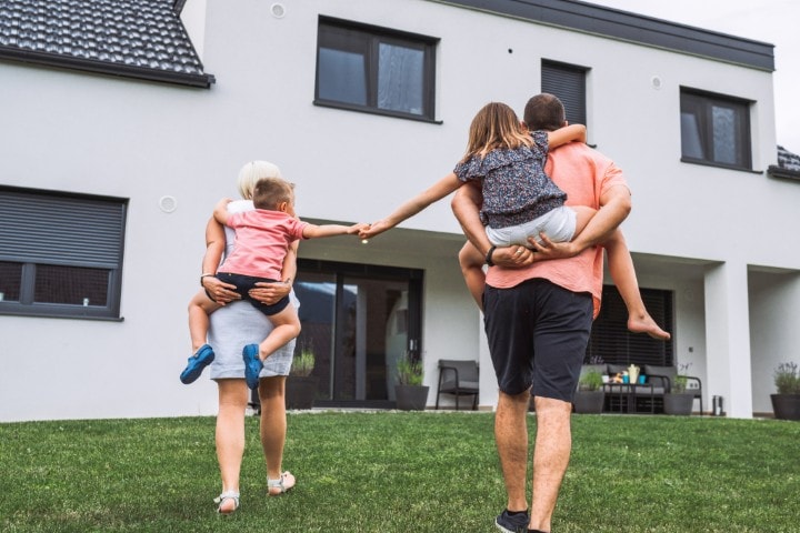 A family walking towards their home